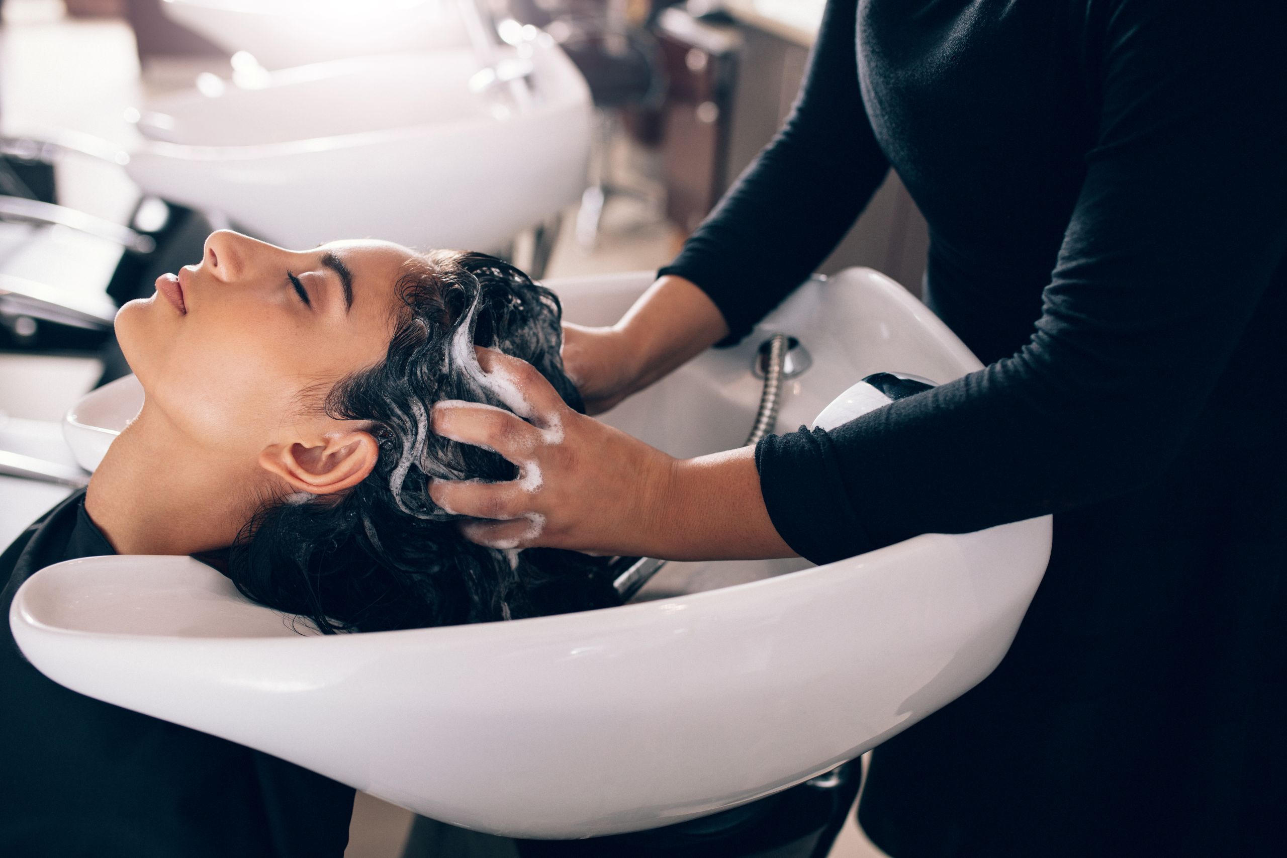 Washing hair in a salon bowl