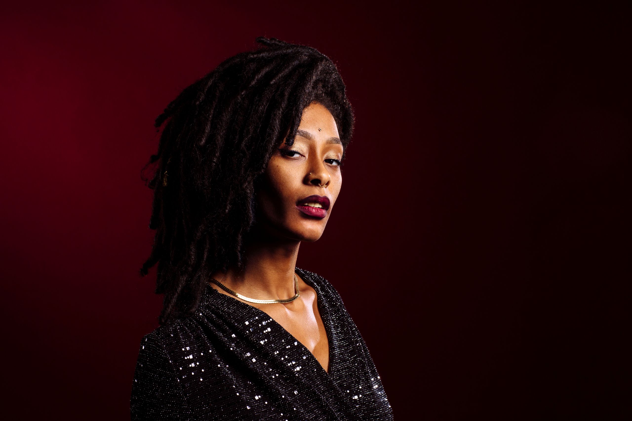 Black woman with a red background